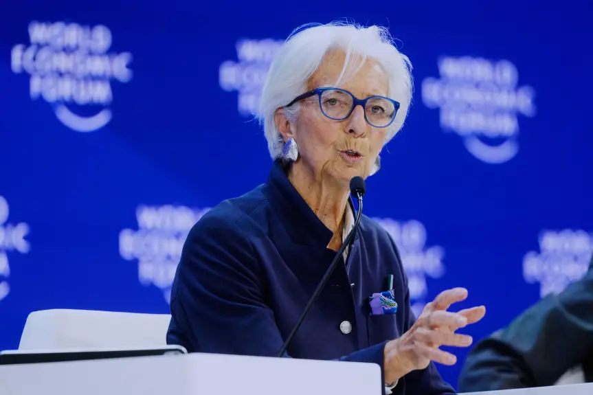 Christine Lagarde, President of the European Central Bank, speaking at a microphone during a World Economic Forum panel in Davos, Switzerland