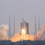 A private Chinese commercial rocket launching from a coastal pad, representing the China private space industry growth.